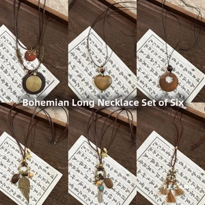 Detail view of Bohemian long tassel necklaces with wooden beads and vintage charms set