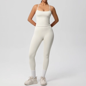 Detail of cream-colored seamless yoga set with thin straps and high-waisted leggings
