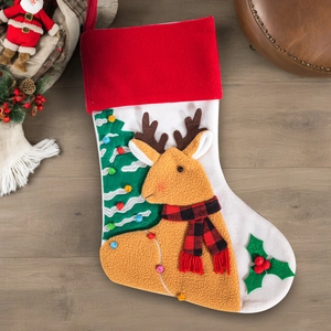 Close-up of decorative Christmas stocking with 3D reindeer and felt tree embroidery