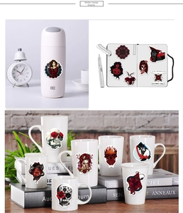 Gothic punk stickers with skull and rose patterns applied on a water bottle and notebook