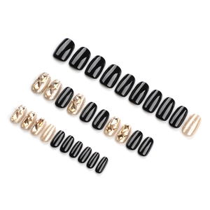 30-piece black and gold glitter press-on nails with champagne rhinestones set