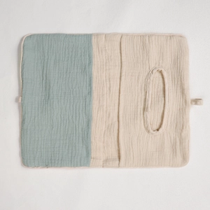 Detail of soft cotton baby crib hanging bag featuring mint green and beige fabric textures