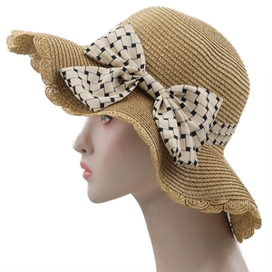 Sombrero de paja para mujer con ala ancha, lazo grande y bordes ondulados para protección solar