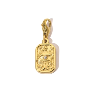 Detail of gold evil eye pendant with lobster clasp and embedded crystal on rectangular plate