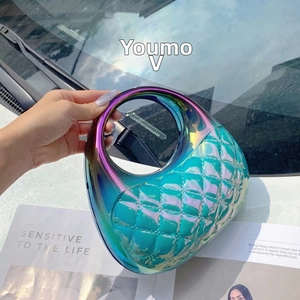Close-up of aurora gradient acrylic clutch featuring a round handle and quilted texture