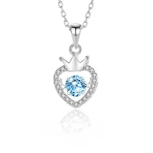 Detail of S925 silver heart necklace with crown motif and blue moissanite center