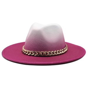 Detail of wool fedora showing ivory to rose red gradient and chunky gold chain strap