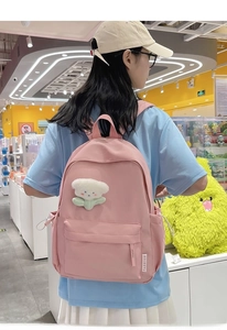 Pink casual backpack with plush flower pendant and FASHION side ribbon detail