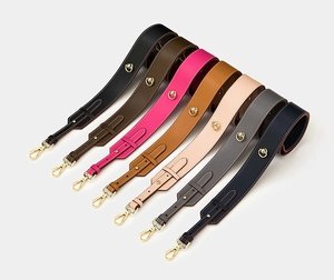 Detail of adjustable wide leather replacement straps with gold hardware in seven colors