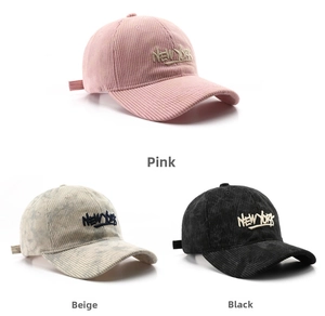 Three corduroy baseball caps in pink, beige, and black with New York embroidery