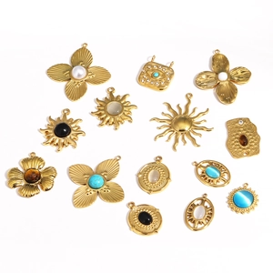 Set of 14 vintage gold titanium steel sun flower pendants with opal and crystal inlays