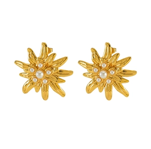 Detail of vintage gold flower earrings with cluster pearls and textured petals