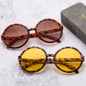Retro round leopard print sunglasses with brown and yellow UV400 lenses and case