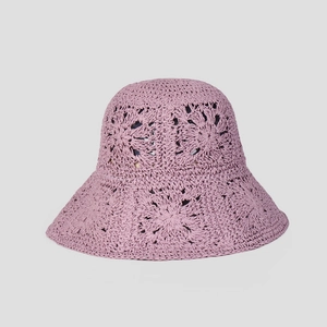 Close-up of handmade crochet lavender sun hat featuring intricate floral hollow patterns