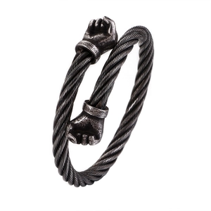 Vintage stainless steel cable bracelet featuring double fist heads and twisted wire design