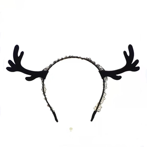 Close-up of black deer horn headband with velvet material and decorative lace trim