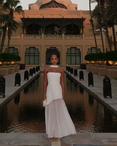 Elegant white strapless maxi dress with a halter neck and sheer chiffon spliced hem details
