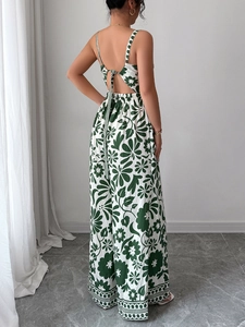 Detail view of backless jumpsuit featuring white-green floral print and tie-back closure