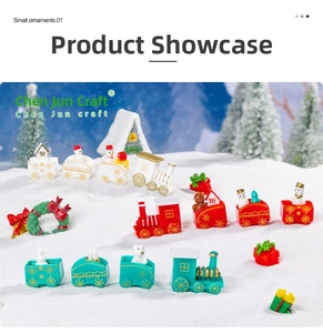 Miniature Christmas train set and snowmen figurines on a snowy decorative landscape