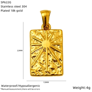 Detailed view of 18K gold plated stainless steel Tarot sun pendant with hammered texture