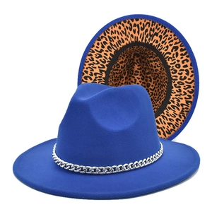 Royal blue fedora hat with silver chain detail and leopard print brim underside