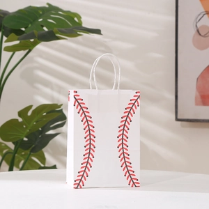 Baseball print gift bag with red stitching and twisted rope handles on white surface