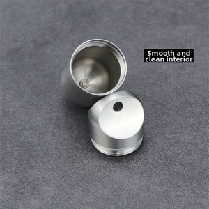 Macro detail of the smooth inner wall and screw threads on titanium capsule box