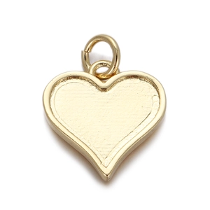 Detailed view of a heart-shaped golden metal pendant with a connector ring and smooth finish
