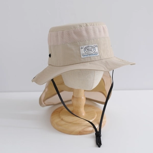 Detail of mesh vents and adjustable chin strap on a beige neck protection sun hat