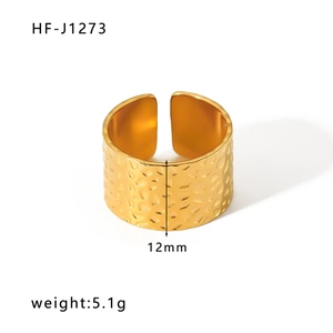Detailed macro view of 12mm wide 18k gold hammered texture stainless steel open ring