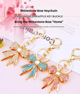 Sparkling rhinestone bow keychain set in white, blue and pink with gold plating