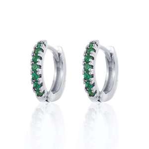 Detail of silver huggie earrings with round green zircon stones in claw setting