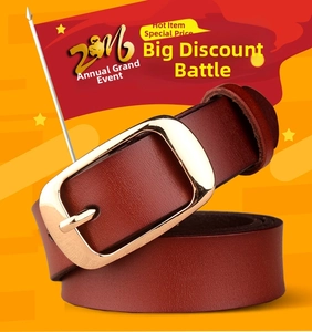 Detail shot of brown leather belt with a polished gold rectangular alloy pin buckle