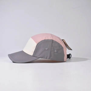 Side view of a tricolor outdoor short brim baseball cap in pink, cream and grey