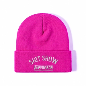 Hot pink knit beanie with white Shit Show Supervisor embroidery on the folded cuff
