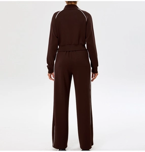 Rear view of brown yoga set jacket and trousers with white side stripes and slim fit design
