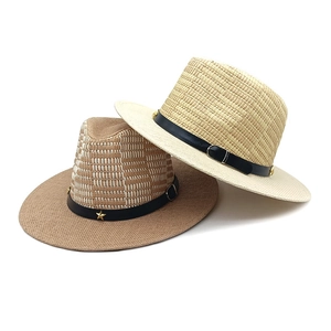 Straw Panama hats in beige and brown with black leather star buckle bands