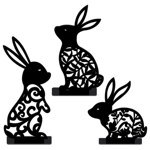 Detailed view of three black hollow-out Easter bunny acrylic tabletop silhouette ornaments