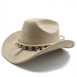 Detail of khaki suede cowboy hat with white tassels, cowrie shells and silver coin charm