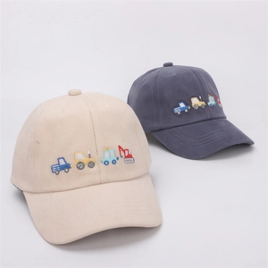 Detailed close-up of cartoon construction truck embroidery on cotton kid baseball caps