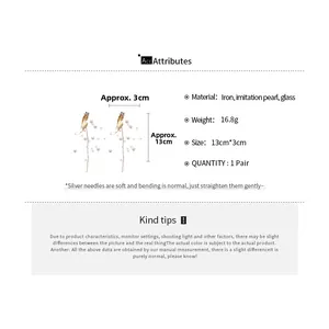 Detailed size and weight specs for gold flower tassel earrings with white pearls