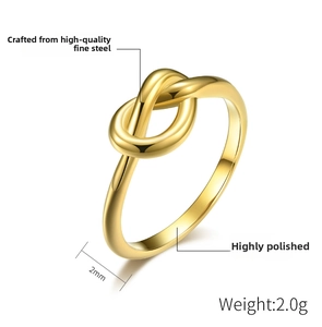 Detailed view of 2mm polished gold stainless steel knot ring showing 2.0g weight and dimensions