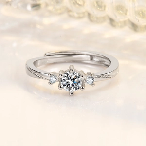 Polished silver adjustable engagement ring with six-prong moissanite setting for couples