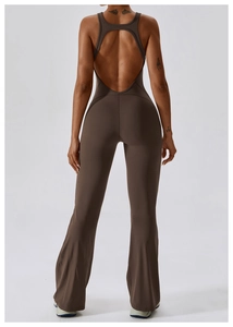 Detail of cross-back yoga unitard featuring an open back and stylish flared leggings