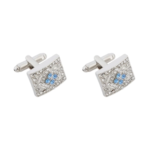 Detail view of silver rectangular cufflinks with blue crystal clover pattern on white background