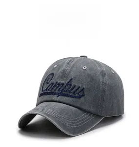 Close-up of vintage washed grey baseball cap featuring navy Campus letter embroidery