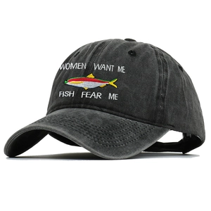 Close-up of vintage dark gray washed cotton baseball cap with fish embroidery detail
