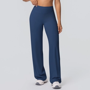 Detail of high-waisted dark blue yoga flare pants with wide elastic waistband