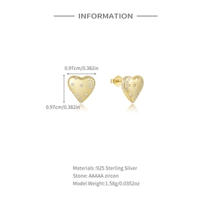 Detail of heart stud earring in 925 sterling silver with AAAAA zircon and golden finish