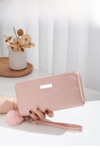 Pink chevron quilted long wallet with golden metal plaque and plush pompom charm